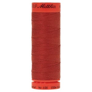 May include: A spool of red thread with the text "Mettler" and "No. 100 150m/164yd" on the label.