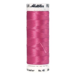May include: A spool of pink thread with the text "Metzler" and "Polyester No. 40 200" on the label.