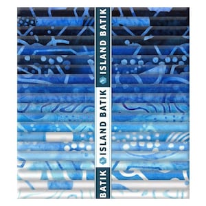 May include: A stack of fabric strips featuring a blue gradient color palette, ranging from deep navy to light sky blue. Each strip displays unique batik patterns with white and blue motifs. A vertical paper band labeled ISLAND BATIK is centered.
