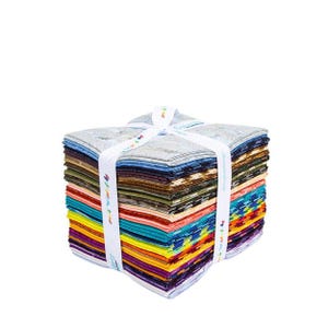 May include: A stack of colorful fabric squares, neatly arranged and tied with a white ribbon. The fabric features a variety of patterns and colors, including blue, green, red, and yellow. The ribbon has colorful text.