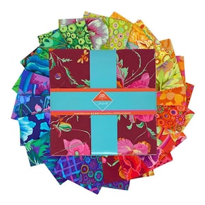 May include: A set of 18 fabric squares featuring a variety of colorful patterns, including floral, geometric, and abstract designs. The squares are arranged in a circle and are tied together with a blue ribbon. The fabric squares are from the "Love, Lush & Layers" collection by the designer "The Fat Quarter Shop".
