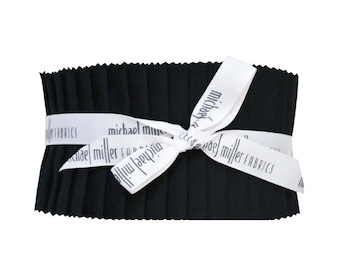 May include: A black fabric bundle tied with a white ribbon. The ribbon has the text "michael miller fabrics" printed on it.
