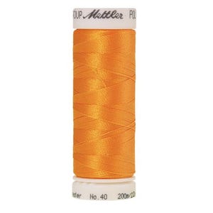 May include: A spool of orange thread with the brand name "Mettler" printed on the label. The spool is labeled "No. 40" and "200m/220yd".