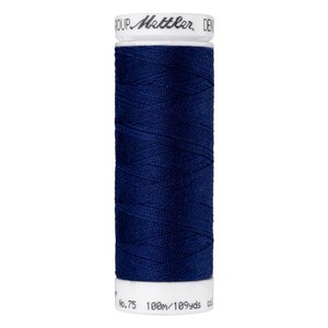 May include: A spool of dark blue thread with the text "ROUP Mettler, DEN" and "No.75 100m/109yds". The thread is tightly wound around a white spool.