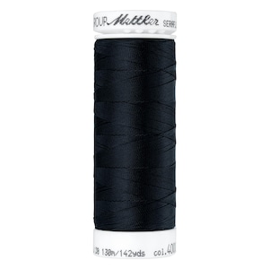 May include: A spool of black sewing thread. The label reads "Mettler SERAFIL". The spool contains 130m/142yds of thread, color 4001.