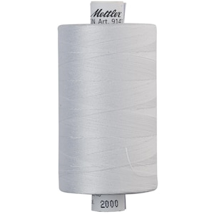 May include: A white spool of thread with a label that reads "Mettler" and "Art. 9141". The spool is labeled with the number "2000".