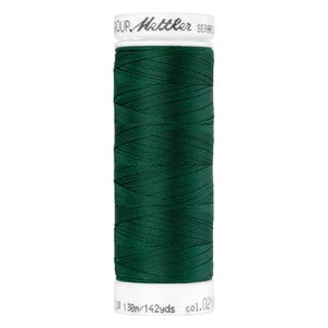 May include: A spool of dark green thread with the text "POUR  Mettler SERAFIL" on the label. The label also includes the text "138m/142yds col. 024".