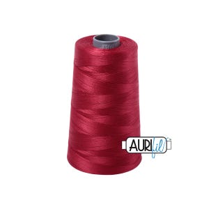 May include: A spool of red thread, with the brand name "Aurifil" visible on the label. The thread is tightly wound on a conical spool, and the color is a deep, rich red. The spool is set against a white background.