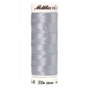 May include: A spool of light blue thread with the brand name "Mettler" and the text "Poly" on the label. The spool is 200 meters long and 220 yards long.