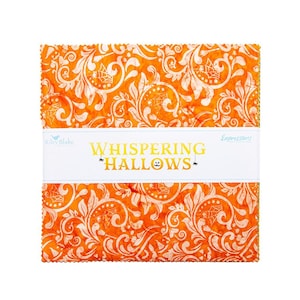May include: A square stack of orange fabric squares featuring a white damask-style pattern with spiderwebs, bats, and pumpkins. A white paper band wraps around the center with the text Whispering Hallows, Riley Blake, and Expressions printed.