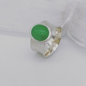 Sterling silver ring set with an oval dyed jade stone