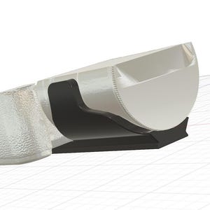 May include: A 3D-rendered object with a white, semi-circular design and a textured, transparent end. It is supported by a black base and a black, curved support.