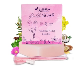 May include: Pink Flower Gentle Soap Bar by Fivona, a handmade herbal soap bar with a pink flower design on the packaging. The soap bar is 150GM (5.3oz) and comes with a pink mesh bag.
