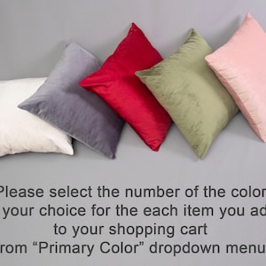 May include: Five decorative throw pillows in different colours: white, grey, red, green, and pink. Please select the number of the colour of your choice for each item you add to your shopping cart from the "Primary Colour" dropdown menu.