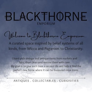 May include: A dark blue and white watercolor-style background featuring the text BLACKTHORNE EMPORIUM, Welcome to Blackthorne Emporium, A curated space inspired by belief systems of all kinds, from Wicca and Paganism to Christianity, and ANTIQUES . COLLECTABLES . CURIOSITIES.