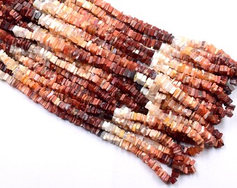May include: A strand of red, orange, and white gemstone beads. The beads are square shaped and have a rough, natural texture.