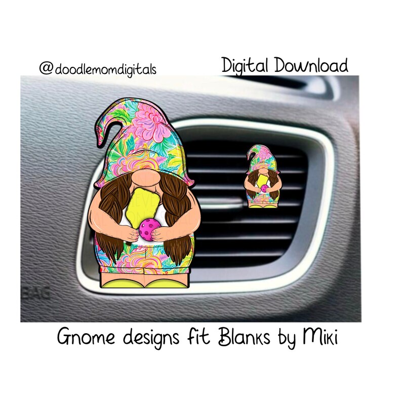 May include: A colorful floral gnome holding a pink and yellow ball. The gnome is designed to fit a car air freshener blank. The image includes the text "Gnome designs fit Blanks by Miki".