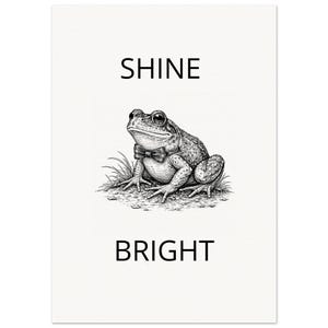 May include: Monochrome illustration of a frog wearing a bow tie, positioned on grass. The words "SHINE" and "BRIGHT" are printed above and below the frog, respectively, on a white background.