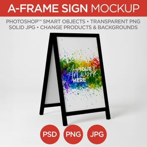 May include: Black A-frame sign mockup with a white interior. The sign features colorful paint splatters and the text "Your Art Work Here." The bottom of the sign has red circles with the text "PSD," "PNG," and "JPG."
