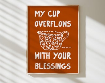 May include: A brown poster with white text that reads "My cup overflows with your blessings" and a white illustration of a teacup with a floral pattern. The text "Psalms 23:5" is also included in white.
