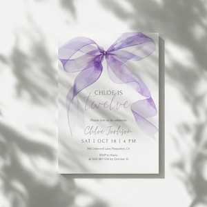 May include: A white invitation card with a large, translucent purple bow at the top. The text "Chloe is twelve" is in a script font. Additional text includes the event details: date, time, location, and RSVP information.