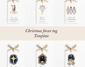 Puede incluir: Etiquetas de recuerdo navideñas con ilustraciones de acuarela de escenas de la natividad, ángeles y estrellas. Cada etiqueta es rectangular, con una cinta beige atada en la parte superior. Texto: "Paz en la Tierra".