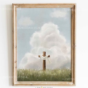 Könnte beinhalten: Ein gerahmtes Gemälde, das ein Holzkreuz mit einem weißen Tuch darüber zeigt, das in einem Feld mit grünem Gras vor einem blauen Himmel mit weißen Wolken steht.