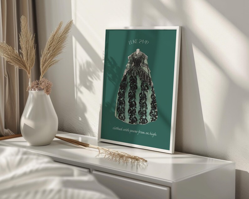 May include: A framed print with a green background featuring a black and green dress with the text "Luke 2:19" and "clothed with power from on high".