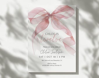 May include: A white invitation card with a watercolor-style pink bow at the top. The text "CHLOE IS twelve" is in a script font. Below, it reads "Please join us to celebrate Chloe Jorhson SAT | OCT 18 | 4 PM".
