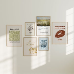 May include: A collection of six framed prints with inspirational quotes and illustrations. The prints are in a variety of styles, including a floral design, a landscape, and a simple text design. The prints are all in a light wood frame.
