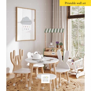 May include: A white wooden table with four chairs, two with deer antlers and two with bunny ears. The table is set with a white teapot and two teacups. A small wooden market stand with a green awning is in the background. The text "MARKET" is visible on the stand. The chairs and table are on a woven rug.