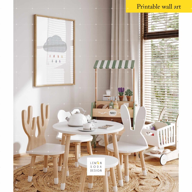 May include: A white wooden table with four chairs, two with deer antlers and two with bunny ears. The table is set with a white teapot and two teacups. A small wooden market stand with a green awning is in the background. The text "MARKET" is visible on the stand. The chairs and table are on a woven rug.