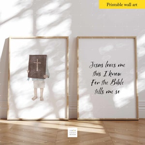 May include: Two printable wall art prints with a Christian theme. The first print features a child holding a Bible with a cross on the cover. The second print features the text "Jesus loves me this I know For the Bible tells me so".