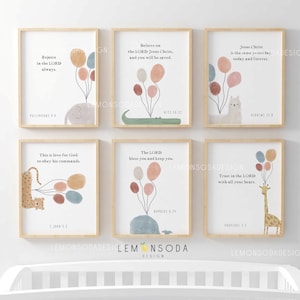 May include: Six framed art prints with inspirational quotes and animal illustrations. Each print features a different animal holding balloons. The quotes include Bible verses. The prints have a light wood frame and are displayed on a white background.