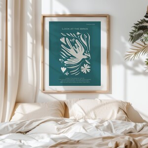 May include: A teal blue poster with a white stylized bird and floral design. The poster has the text "Look at the Birds" and a bible verse from Matthew 6:26.