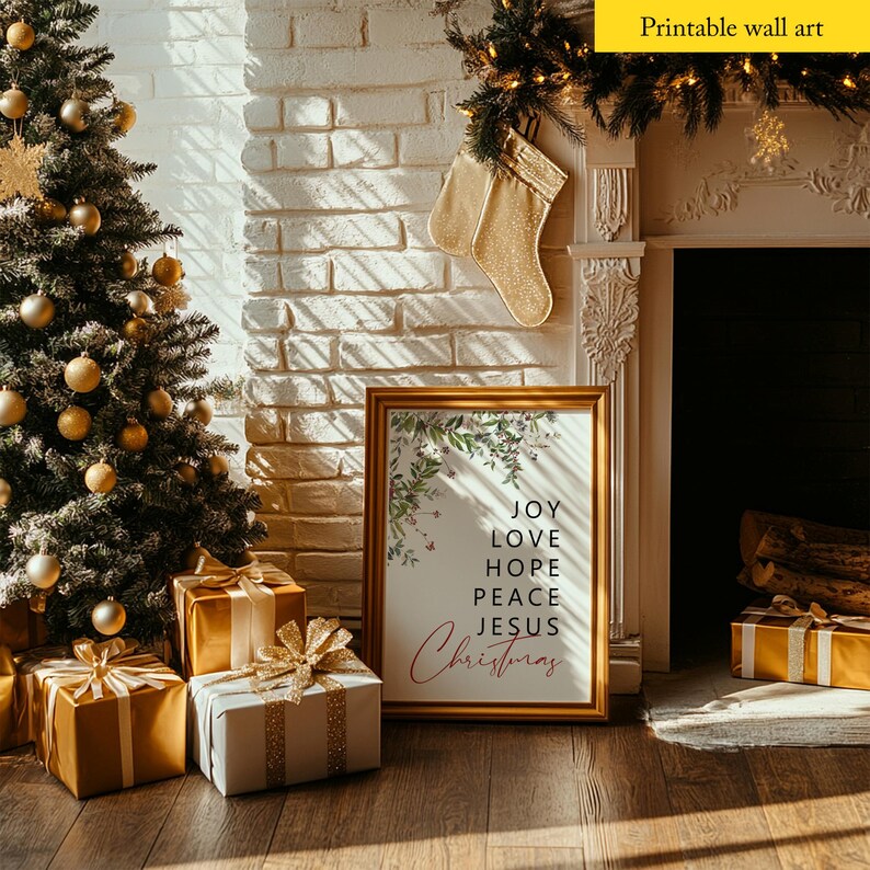 May include: A printable wall art print with a gold frame and a white background. The print features a floral design with the words "Joy, Love, Hope, Peace, Jesus, Christmas" in black text.
