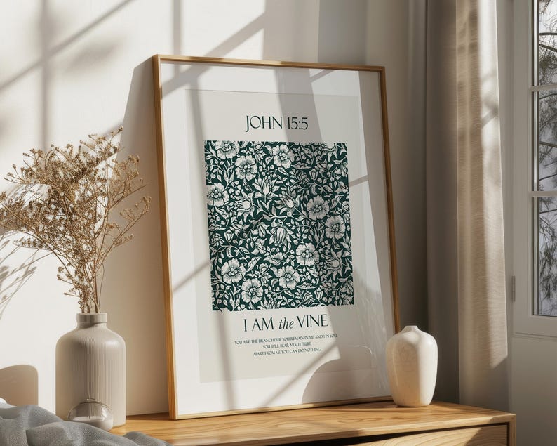 May include: A framed print with a green floral pattern and the text "JOHN 15:5 I AM the VINE" in white. The print is on a white background and has a wooden frame.