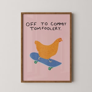 May include: A framed print featuring a cartoon chicken on a blue skateboard against a pink background. The text "OFF TO COMMIT TOMFOOLERY" is written above the chicken. The frame is brown.