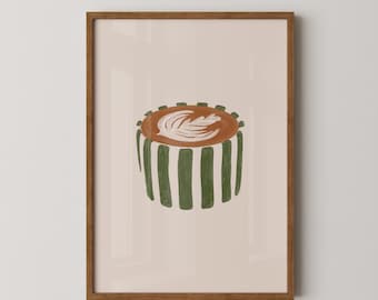 May include: A framed art print featuring a coffee cup illustration. The coffee cup has a brown top with a white leaf design and green striped sides. The background is a light beige color, and the frame is brown.