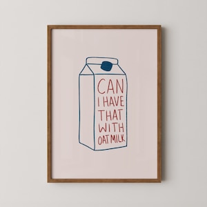 May include: A framed print with a pink background and a blue and white illustration of a milk carton. The text on the carton reads "CAN I HAVE THAT WITH OAT MILK" in red.