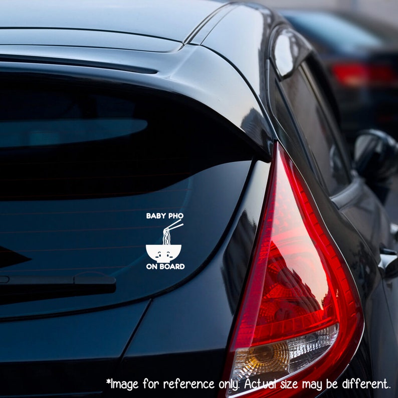 May include: A white vinyl car sticker with the text "BABY PHO ON BOARD" and a cartoon image of a bowl of noodles with chopsticks.