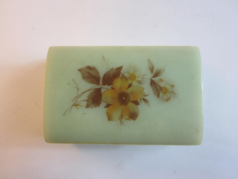 Stunning French vintage jewelry box made from plastic decorated with flower on the lid.
