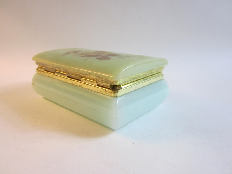 Stunning French vintage jewelry box made from plastic decorated with flower on the lid.