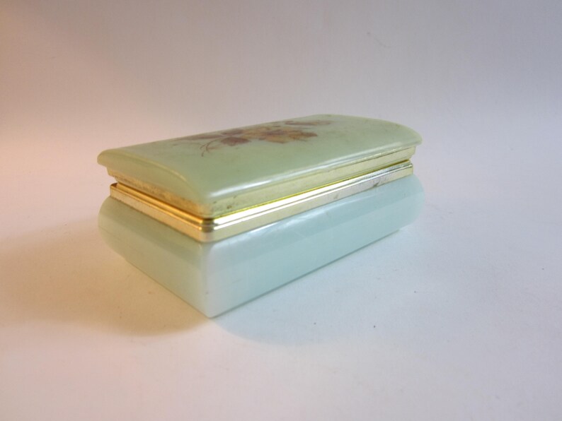 Stunning French vintage jewelry box made from plastic decorated with flower on the lid.
