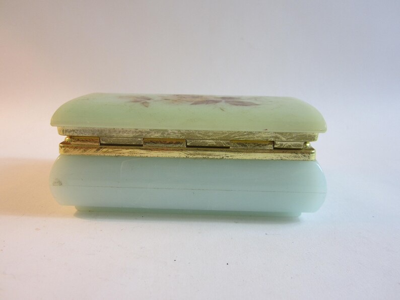 Stunning French vintage jewelry box made from plastic decorated with flower on the lid.