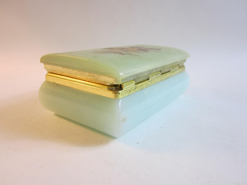 Stunning French vintage jewelry box made from plastic decorated with flower on the lid.