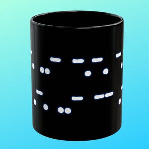 May include: A black ceramic mug with a white design of Morse code dots and dashes.