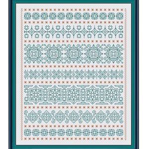 May include: A framed cross-stitch sampler featuring repeating geometric patterns in teal and brown. The design includes stars, squares, and floral motifs, all meticulously stitched on a white background. The frame is a dark teal.