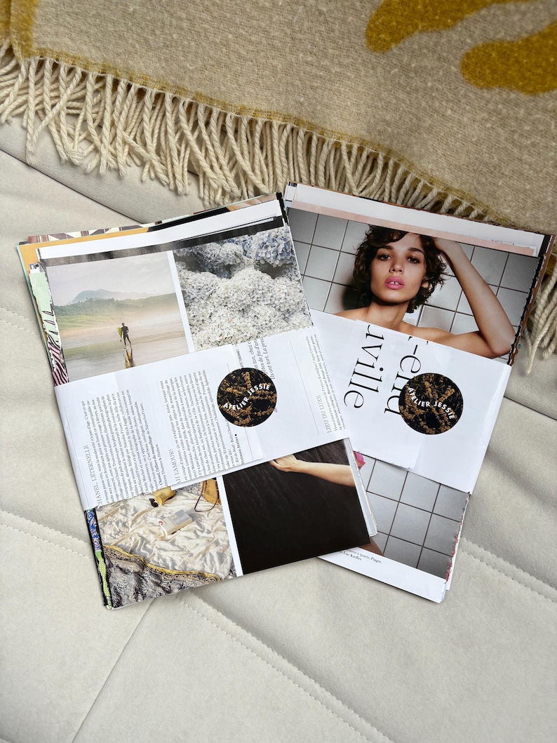 May include: Two magazines are bundled together with a paper wrap. The magazine on the right features a woman with short hair. The magazine on the left has a photo of a person on a beach. The text "Atelier Jessie" is visible.