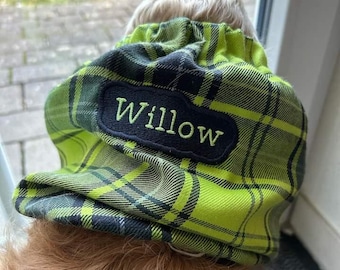 May include: A bright lime green and black plaid fabric snood featuring a black rectangular patch with the name Willow embroidered in light green thread. The accessory has an elasticated gathered top edge and a soft, textured fabric construction.